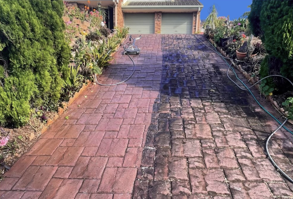 NT Maintenance team member in front of a well-maintained Auckland property